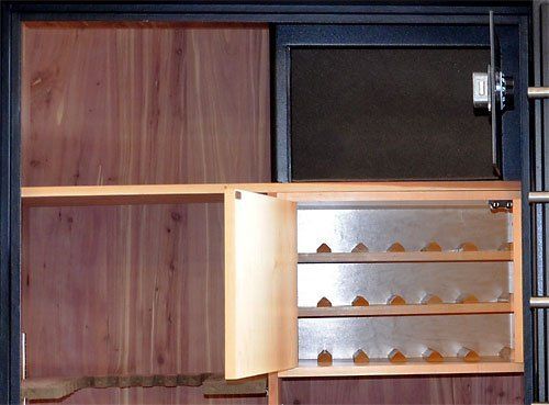 Wooden cabinet with an open door, revealing rows of small shelves or compartments inside.