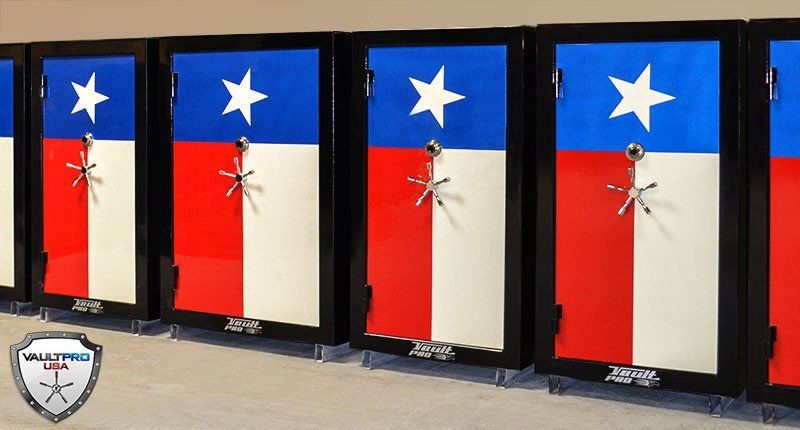 Four black-framed flag panels with Texas-themed red, white, and blue designs on display