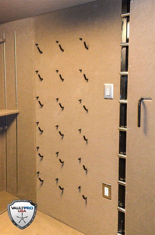 Custom Vault Room with pistol holders, lights and electrical outlets.