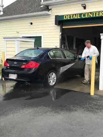 Happy Couple talking with employee - Auto Detailing in Norfolk, MA Happy Couple talking with employee - Auto Detailing in Norfolk, MA