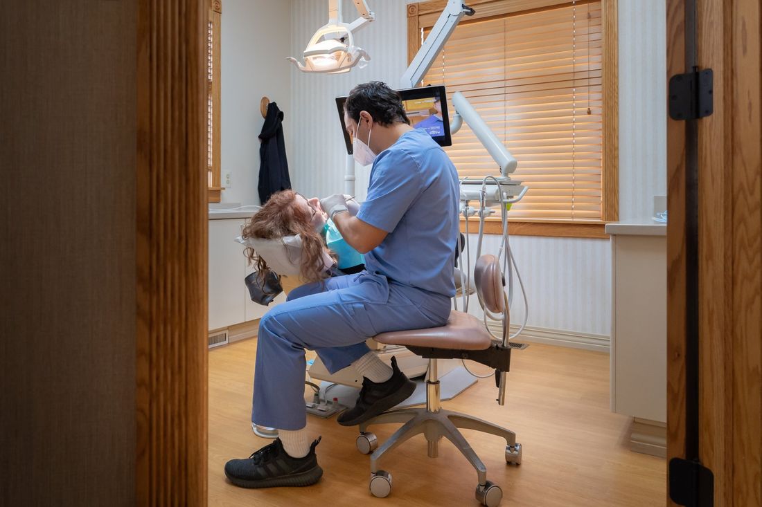 Dr. Hourani with a patient at Tecumseh Family Dental Care