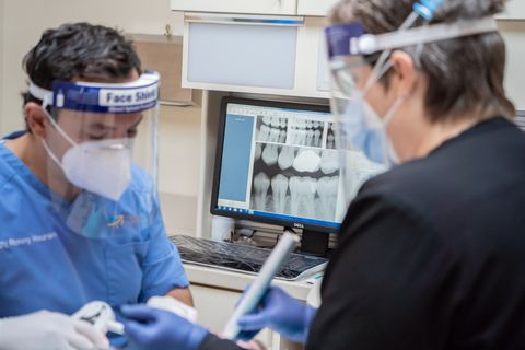 Dr. Hourani with patient at Tecumseh Family Dental Care