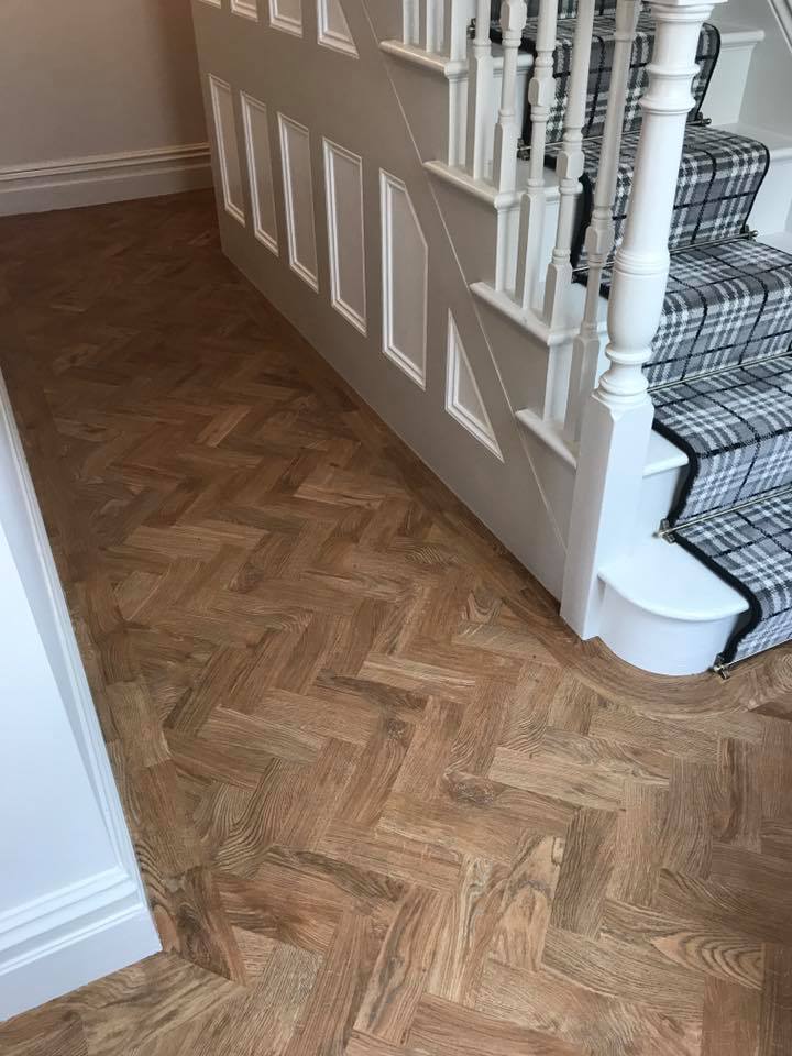 hardwood flooring laid in herringbone pattern