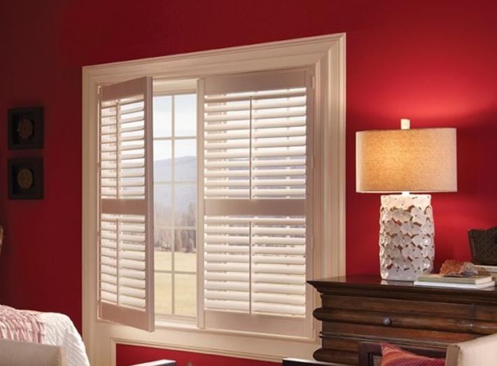 Shutters with divider rail