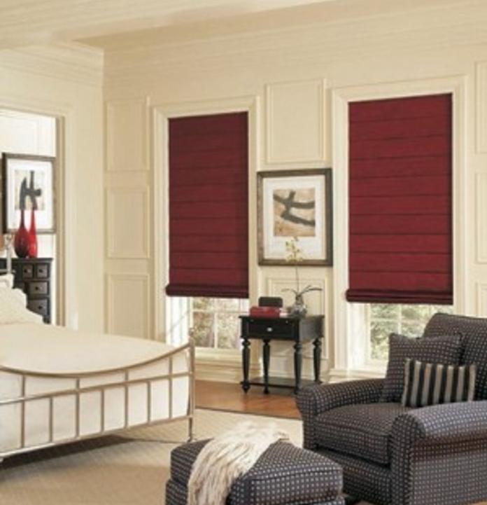 Red Roman Shades in bedroom