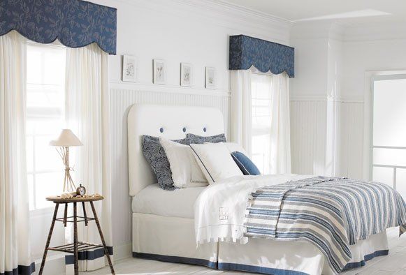 window spaces blue cornices and bedding in bedroom  with Carole fabrics