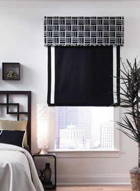 black valance and roman shade with white trimming