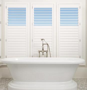 White Composite Shutters with Split Tilt in bathroom windows.