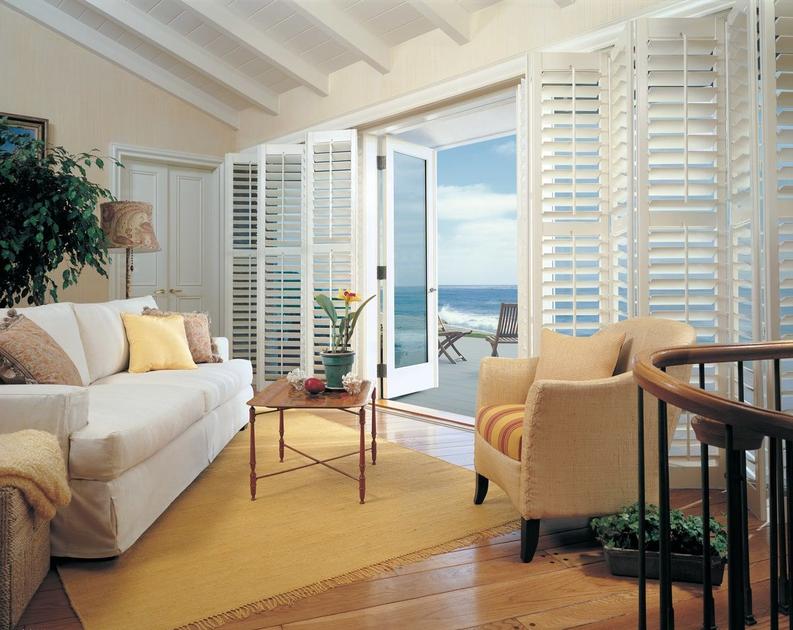Byfold Shutters in living room sliding doors
