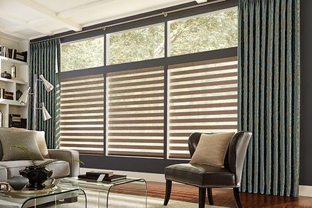 Tan ​​​Layered Shades in living room windows