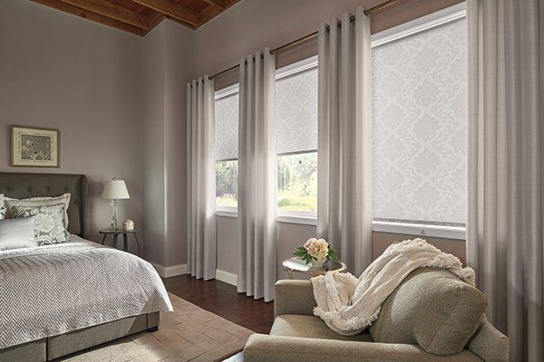 Graber Roller Shades with Drapery Panels in Bedroom