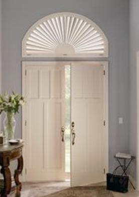 Sunburst Arched Shutter above the door on arched window.