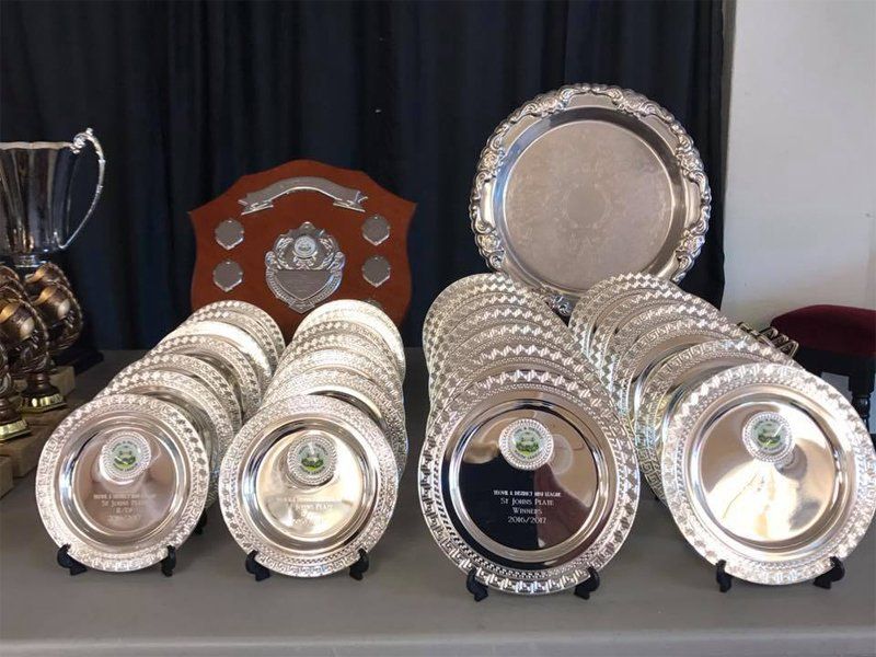 Rows of engraved plates and crests