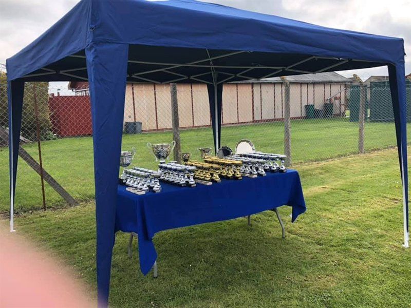 Rows of trophies at outdoor gazebo