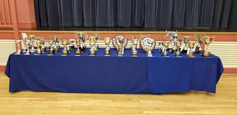 Table of trophies in a hall