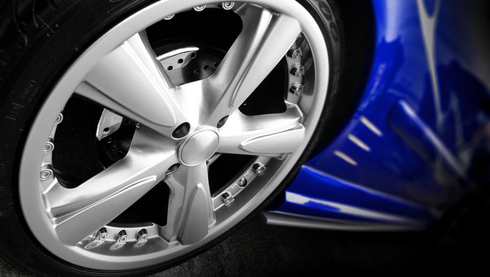 Xtreme Wheel Repair & Powder Coating Feedback — mechanic in uniform is working in auto service.  in Salt Lake, UT