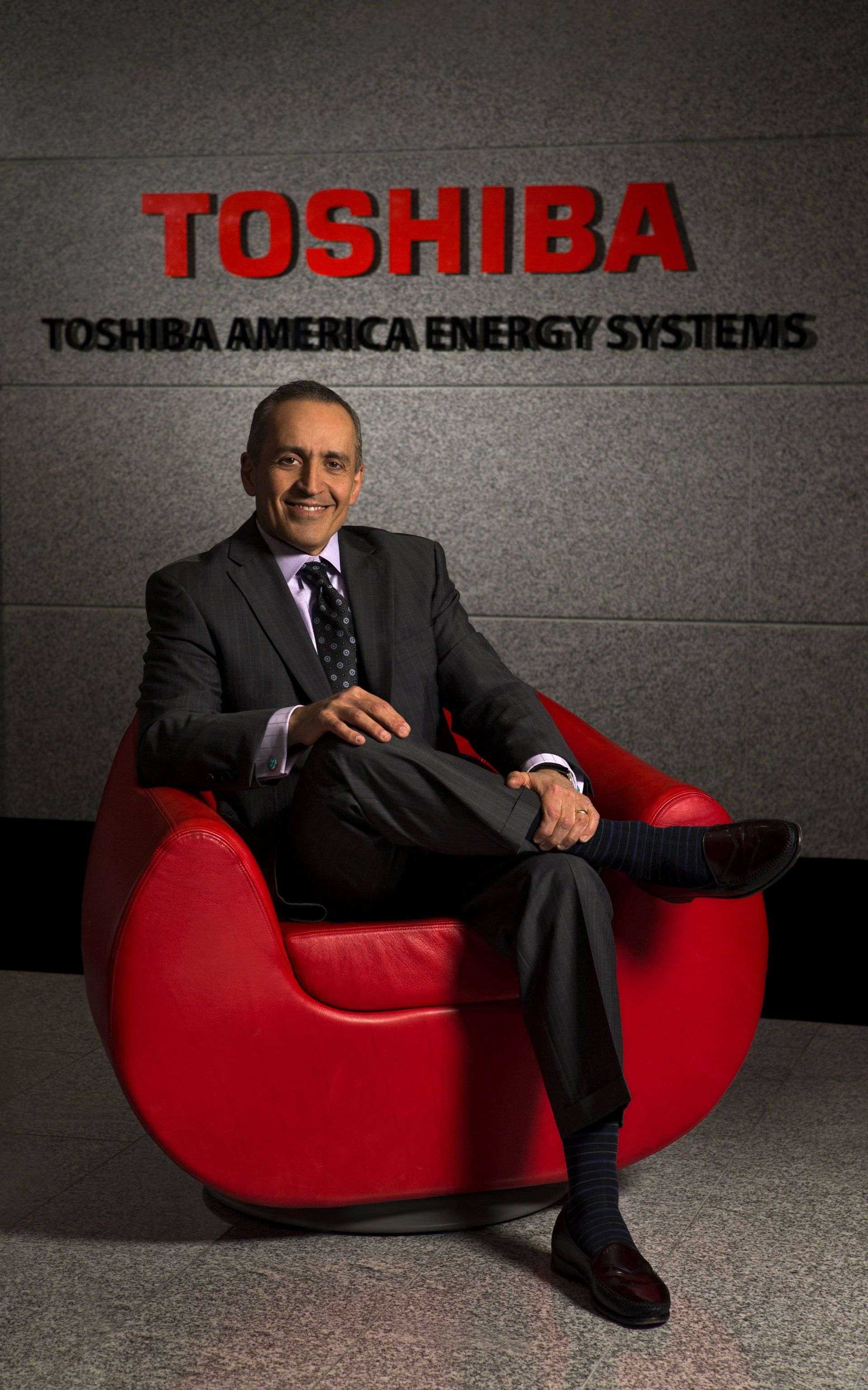 Man in business suite with Toshiba corporation logo