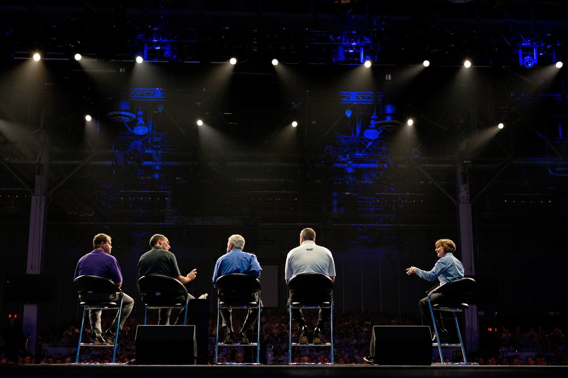 Business panel discussion photograph from behind scenes