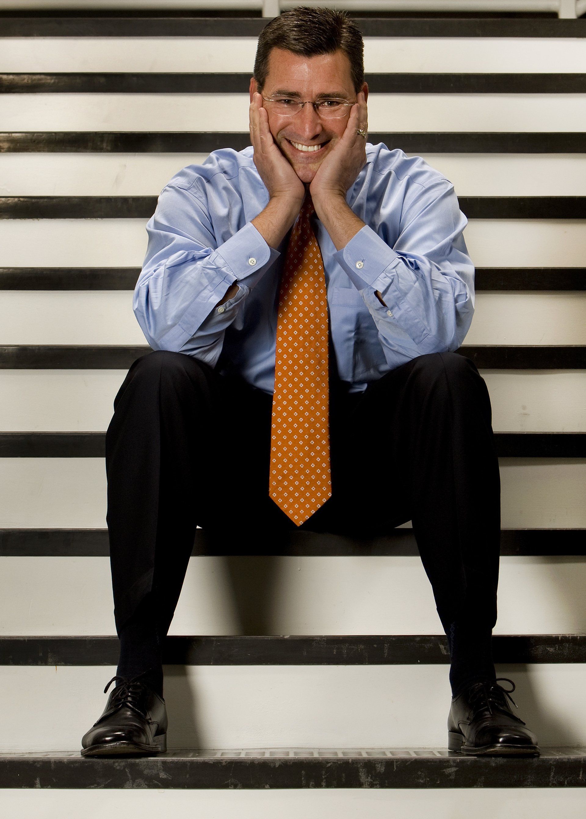 man in business outfit on stairs