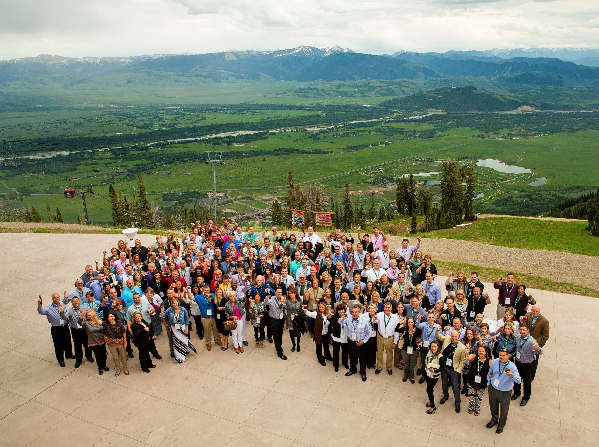 Group photograph of corporate travel winners using drone