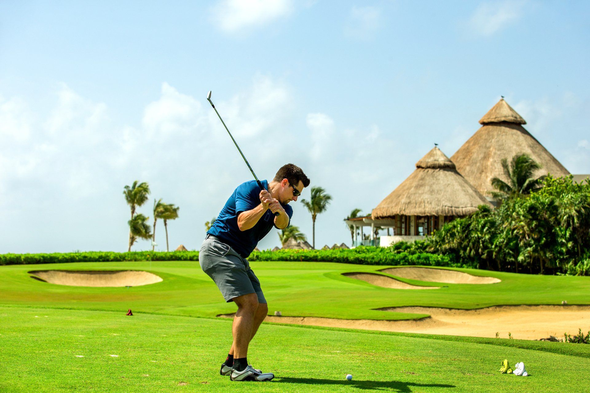 Company employee on the links during a golfing incentive reward travel experience