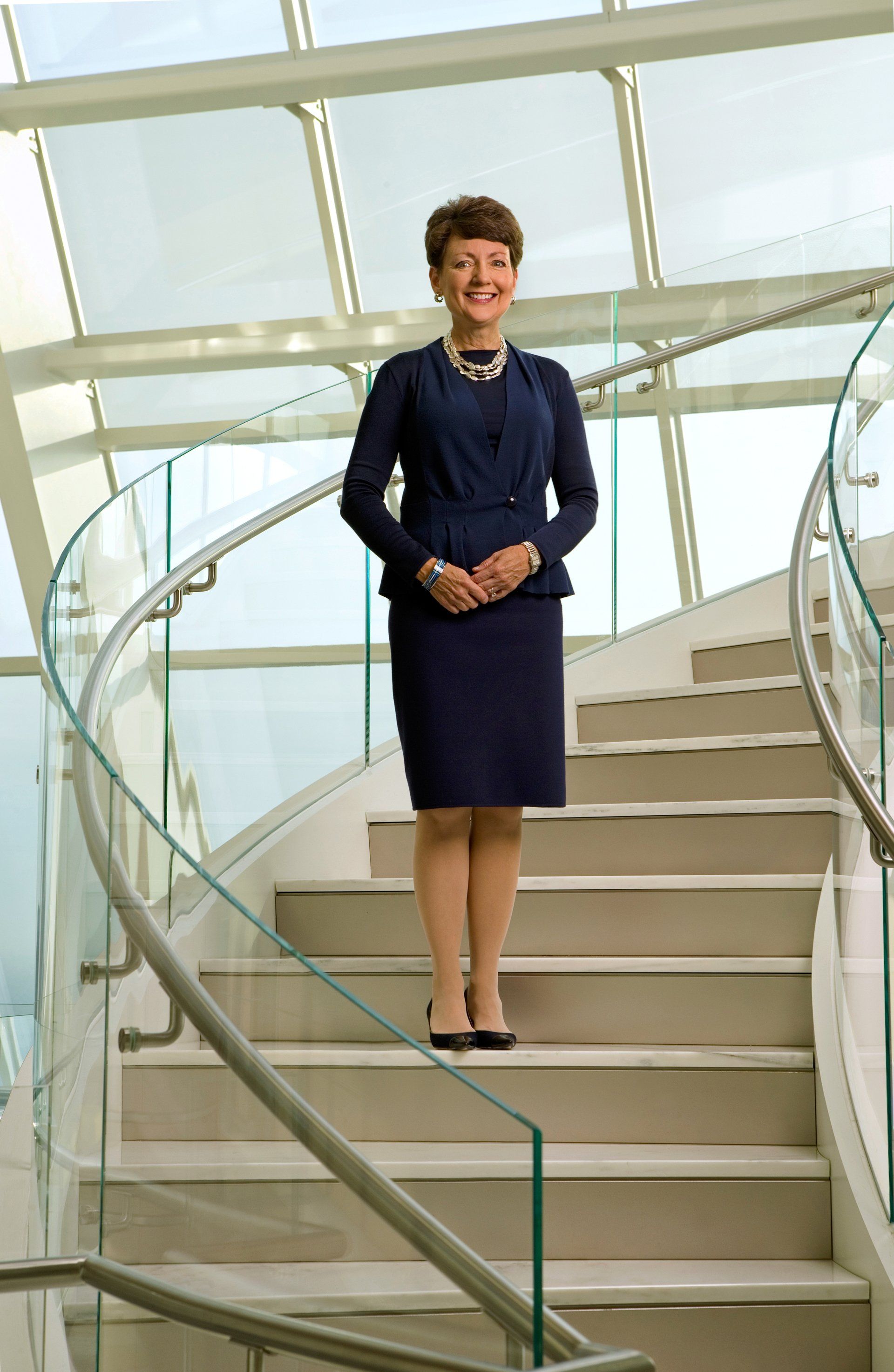 Corporate leader photographed at the top of tall building