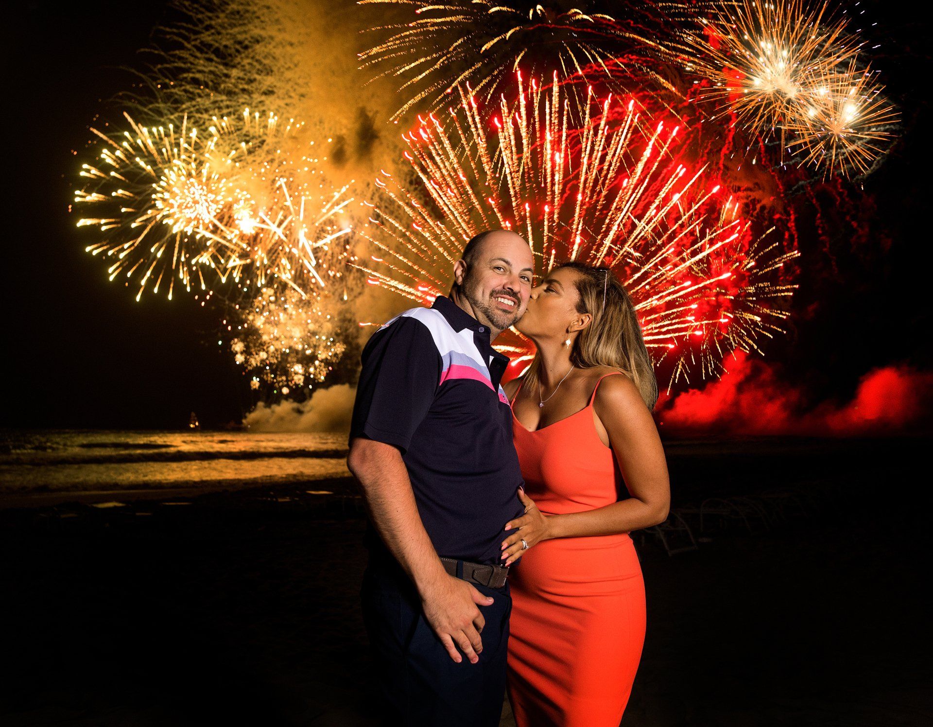 A couple posed with fireworks during an incentive program offered to select company employees