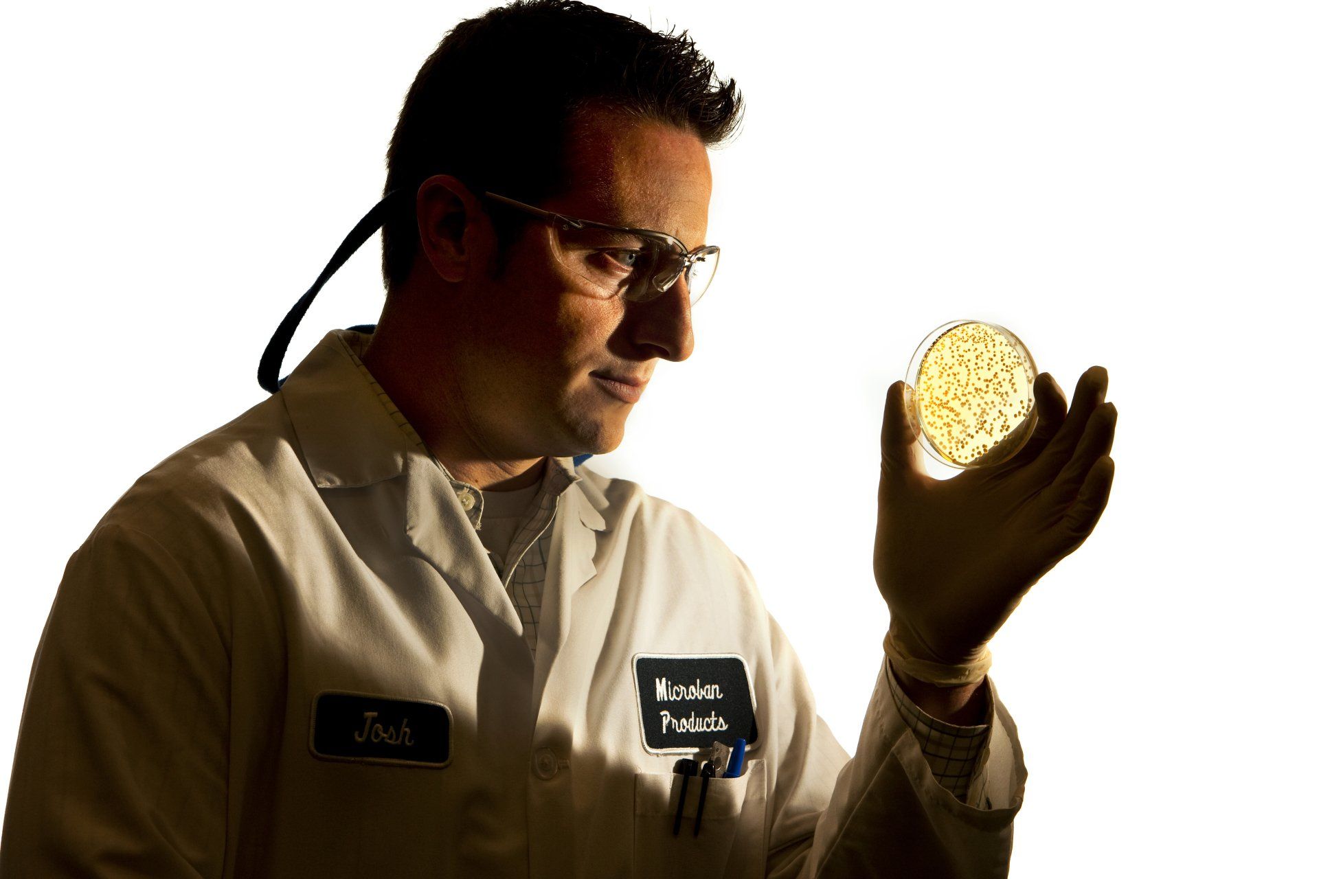 Scientist examines a product closely
