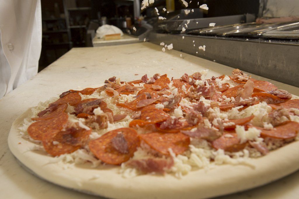 Fresh prepped pizza ready to bake