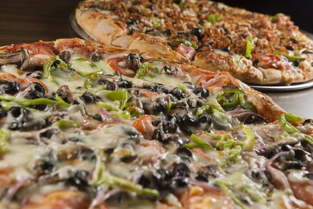 close up of two pizzas