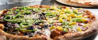 A fresh baked pizza with two kinds of toppings