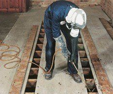 An expert doing damp repair