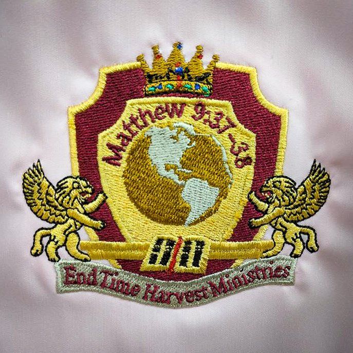 Embroidered End Time Harvest Ministries logo: shield with crown, globe, angels, text 