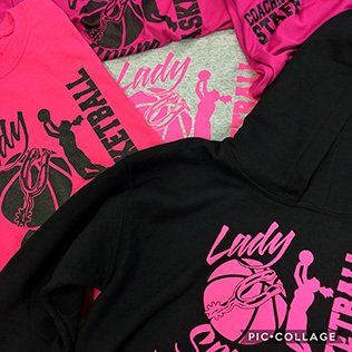 Pink and black Lady Basketball shirts and a hoodie with a basketball graphic.