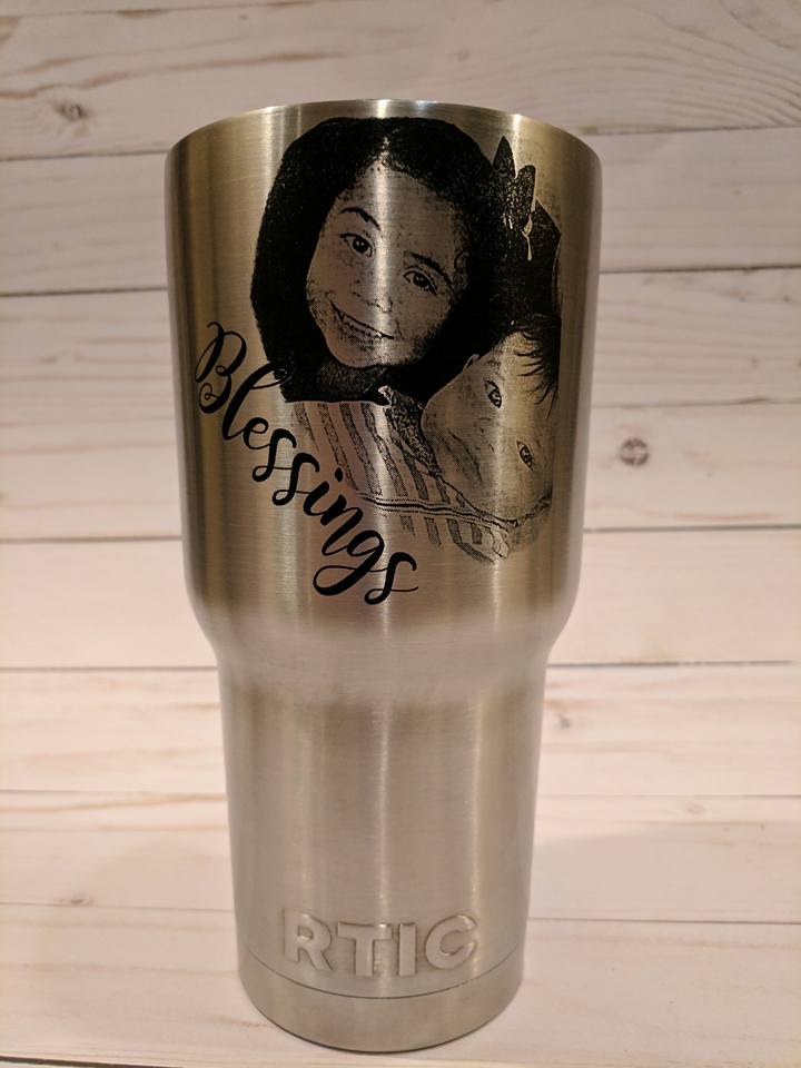 Stainless steel tumbler with engraved portrait and