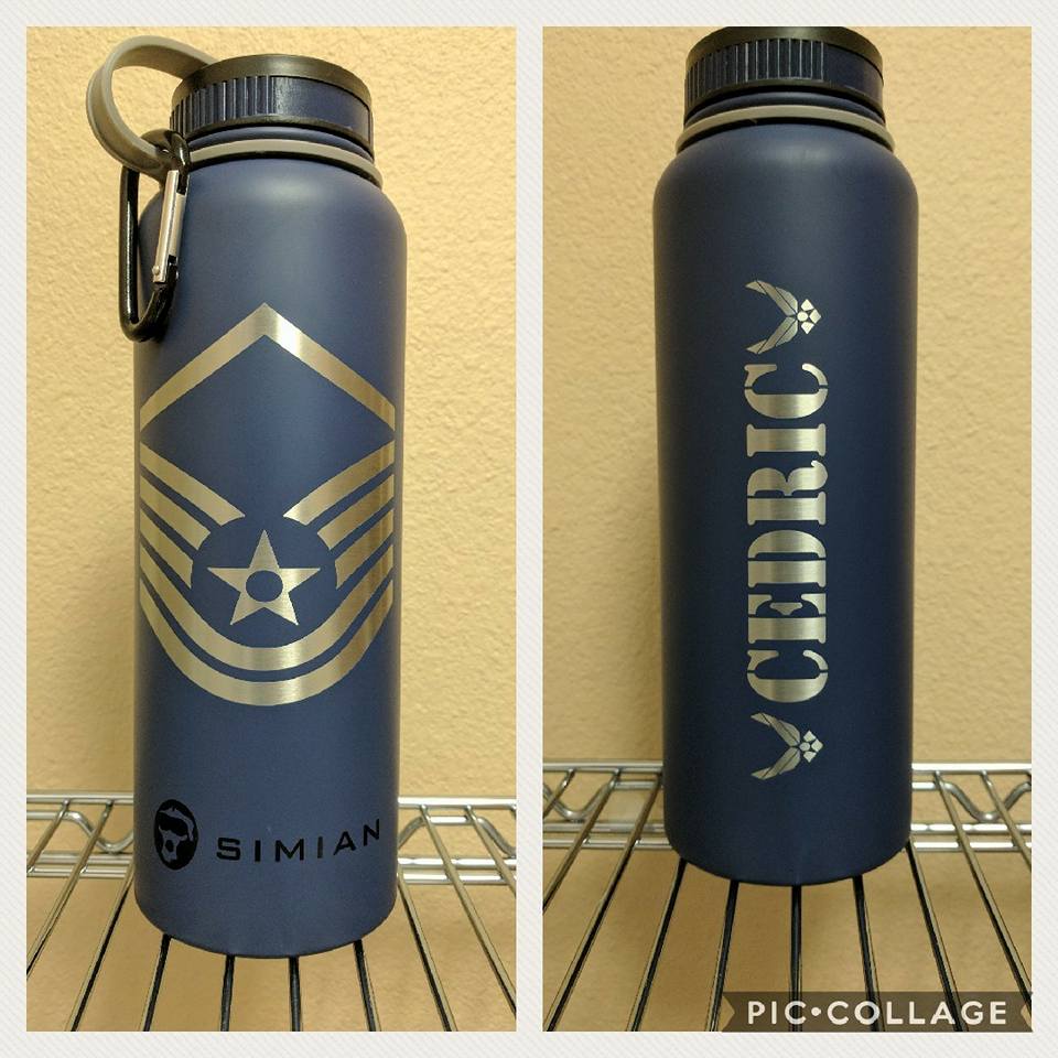 Two blue water bottles with engraved silver Air Force rank insignia and name