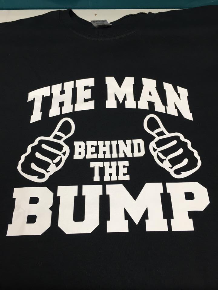 Black t-shirt with white text and thumbs-up graphic: