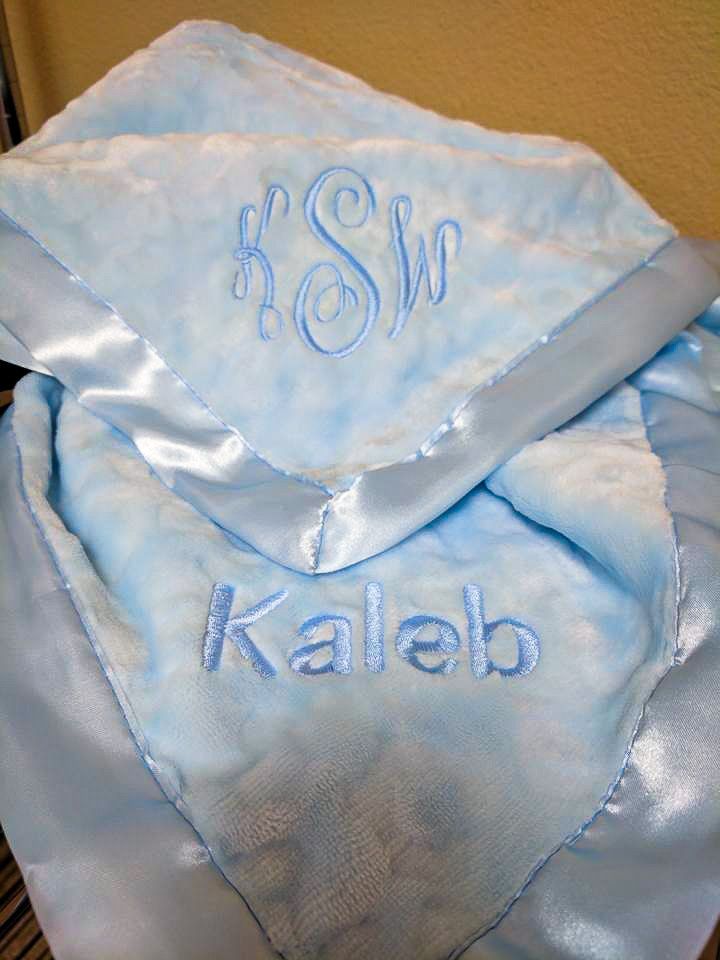 Light blue baby blanket with embroidered initials 