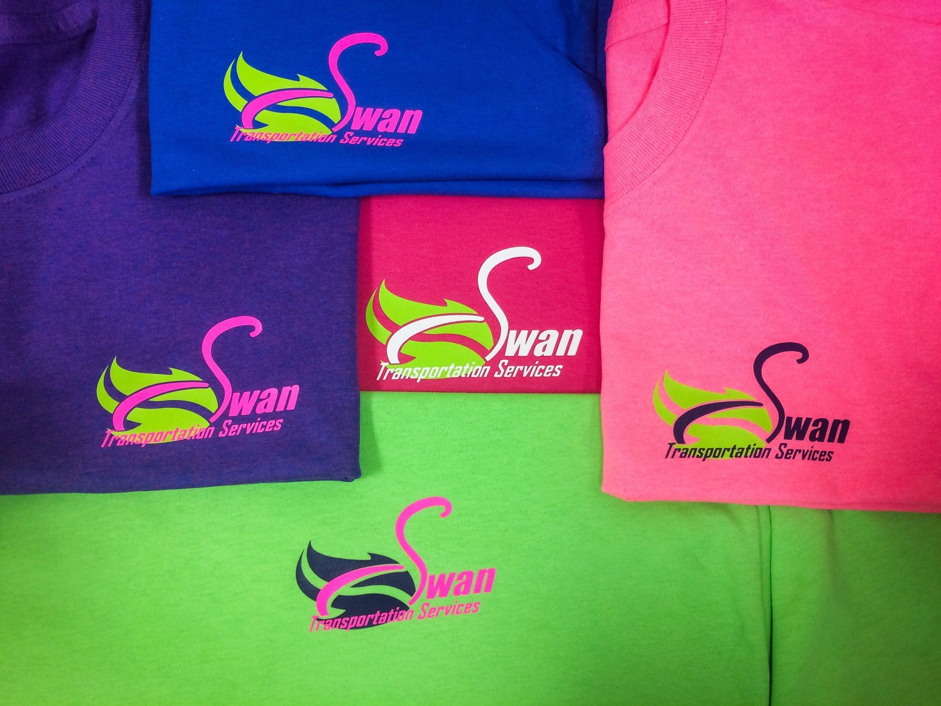Several colored t-shirts with