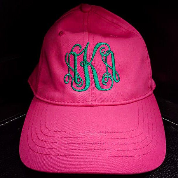 Pink baseball cap with green monogram 
