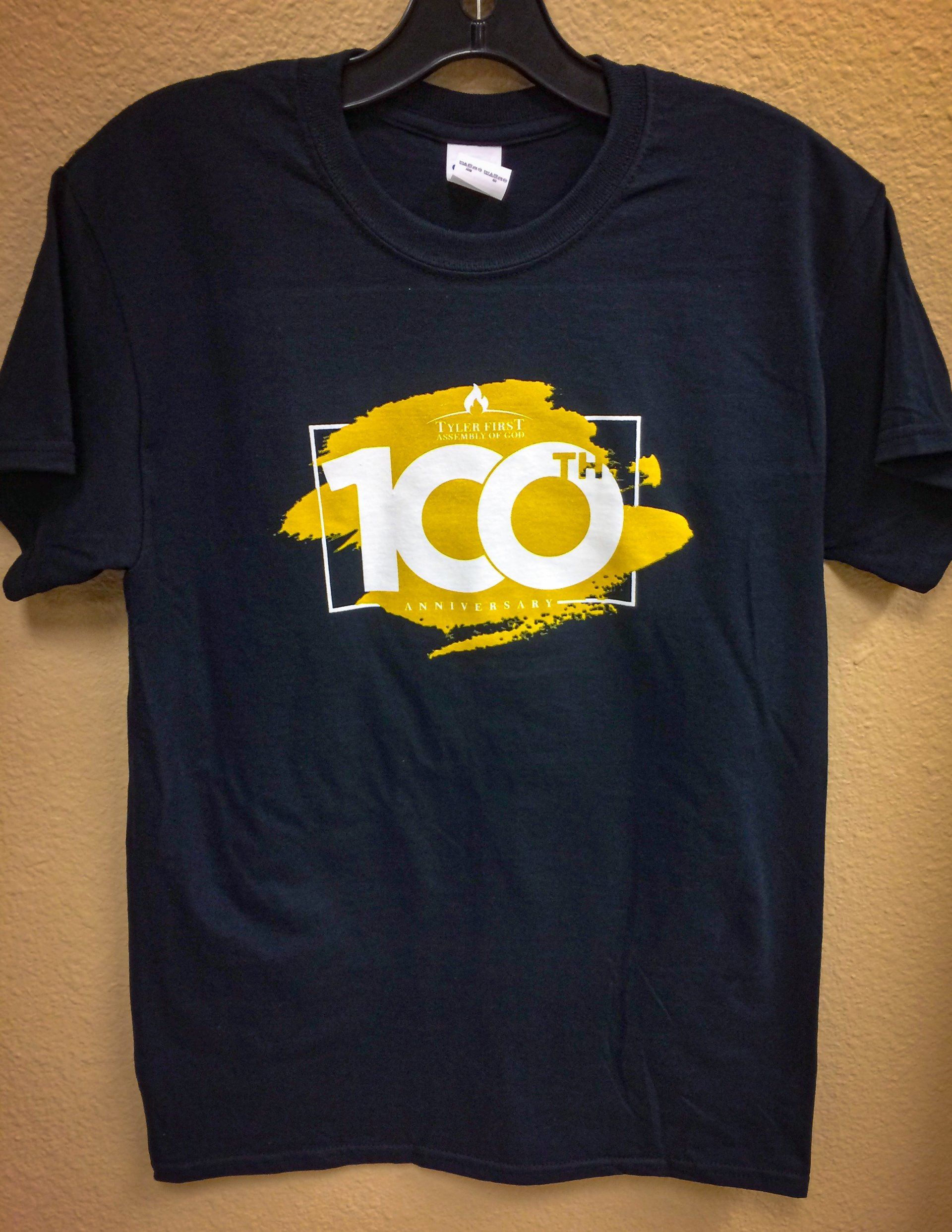 Black t-shirt with a yellow “100th” logo inside a white rectangle on the front.