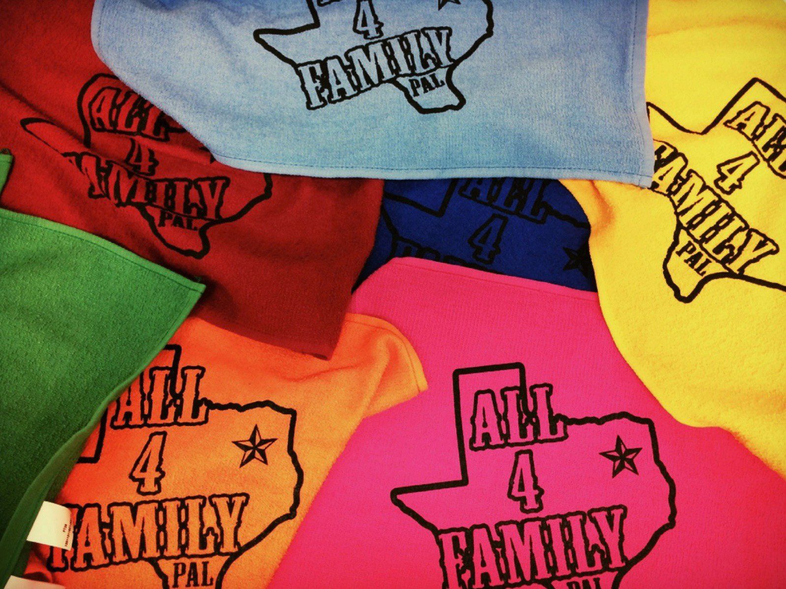Pile of colorful Texas-shaped towels with