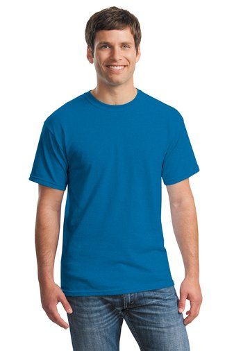 Man in blue t-shirt and jeans smiles.
