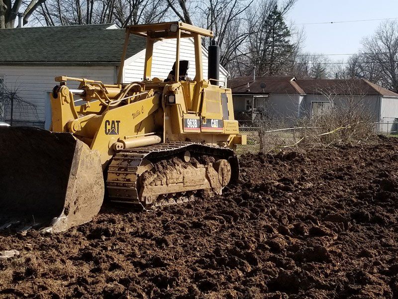 Demolition debris being cleared with a machine