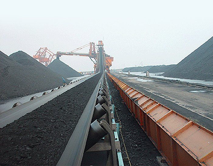 A conveyor belt carrying coal in a coal mine.