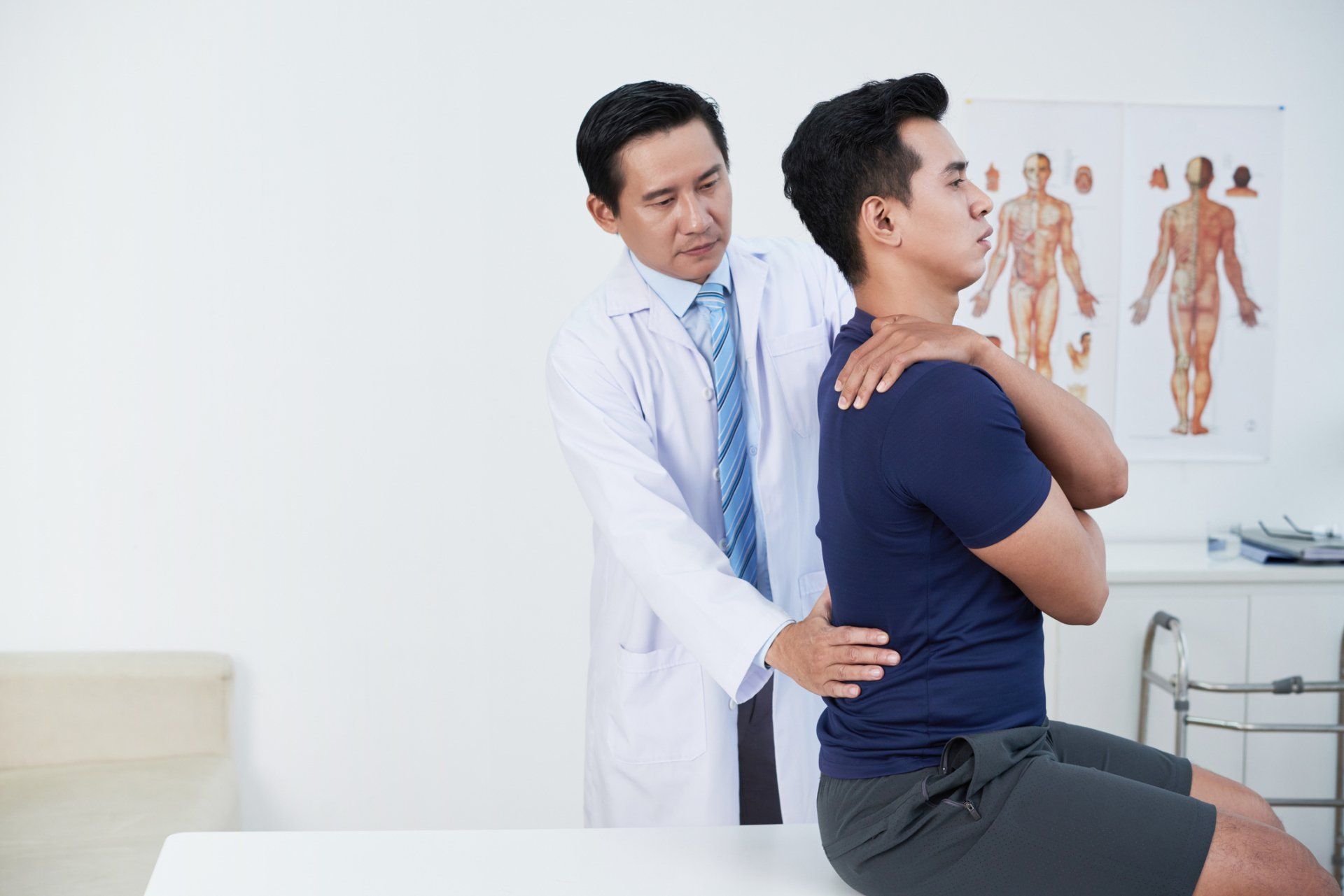 Therapist Motivating Male Patient To Walk Between Cones — Dayton, OH — Pain Evaluation & Management Center