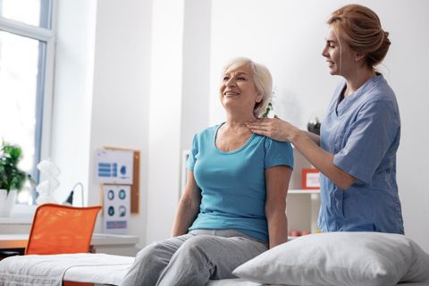 Friendly Nurse Looking At Her Female Patient — Dayton, OH — Pain Evaluation & Management Center Friendly Nurse Looking At Her Female Patient — Dayton, OH — Pain Evaluation & Management Center