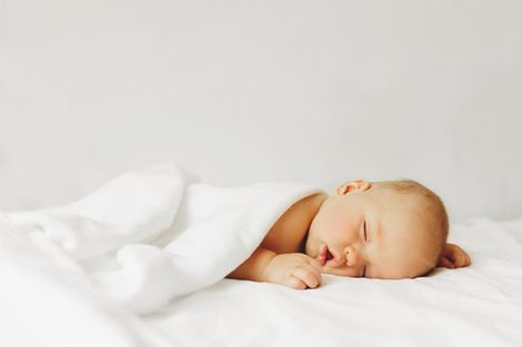 Sleeping Baby on Bed — Maitland, FL — Beckman & Associates Inc. Sleeping Baby on Bed — Maitland, FL — Beckman & Associates Inc.