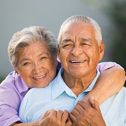 elderly couple smiling