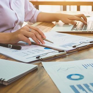 Corporate Accounting Services — Accountant Working with Financial Reports in Upper Darby, PA